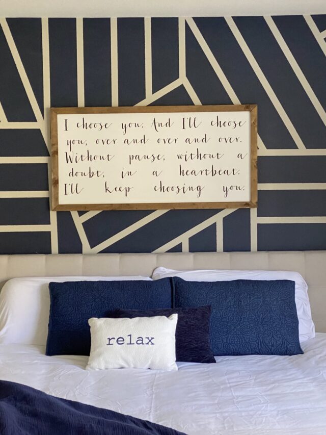 bedroom with navy geometric accent wall