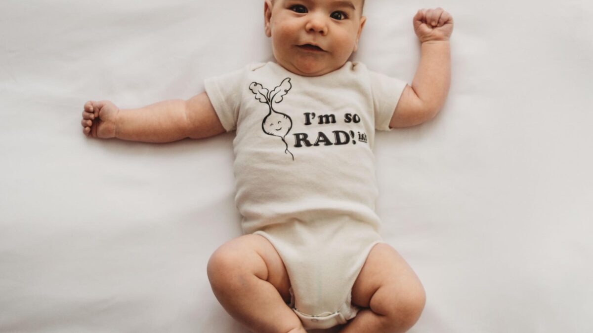 Baby boy wearing onesie that says I'm so radish - funny vegetable pun