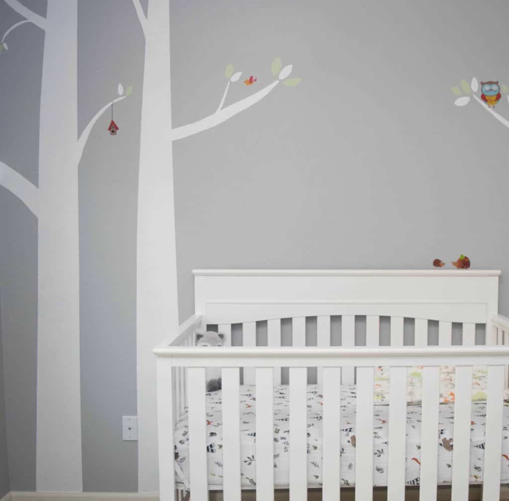 woodland wall mural in gray babys bedroom